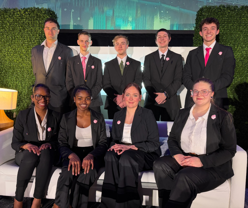 The Pace Marketing team in professional attire at a company event