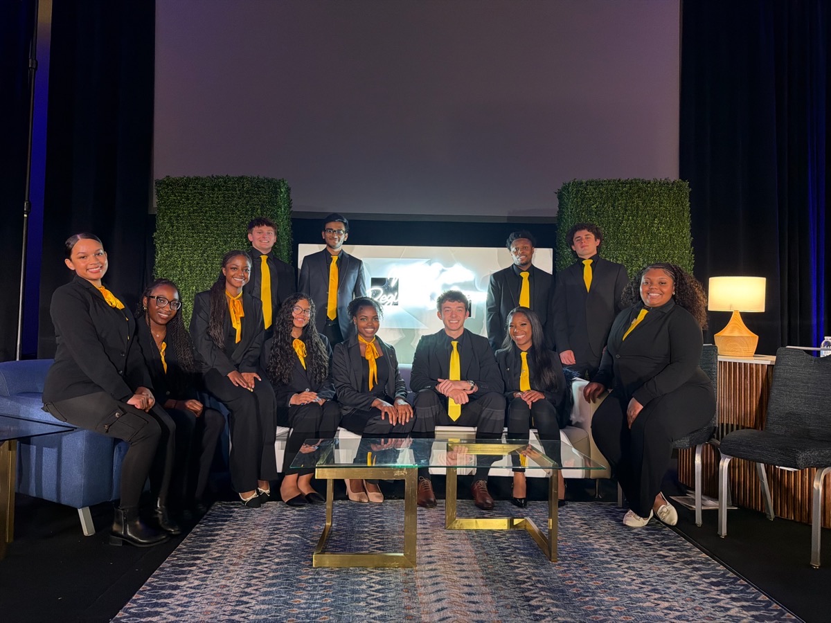 The Pace Marketing team in professional attire at a company event